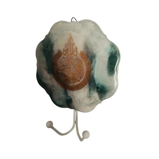 Lele green and pearl keybra emblazoned with a gilded Quranic verse with a two-headed metal stand