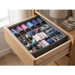 Giant drawer organizer with 24 compartments for organizing small items, underwear, socks, and ties. Practical design with a bottom zipper for easy folding and storage. Made of durable and breathable fabric. Dimensions: 34 x 34 cm