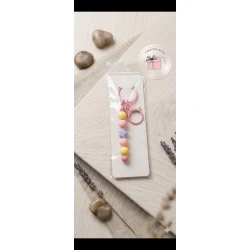 A keychain decorated with beads and a delicate in an elegant design